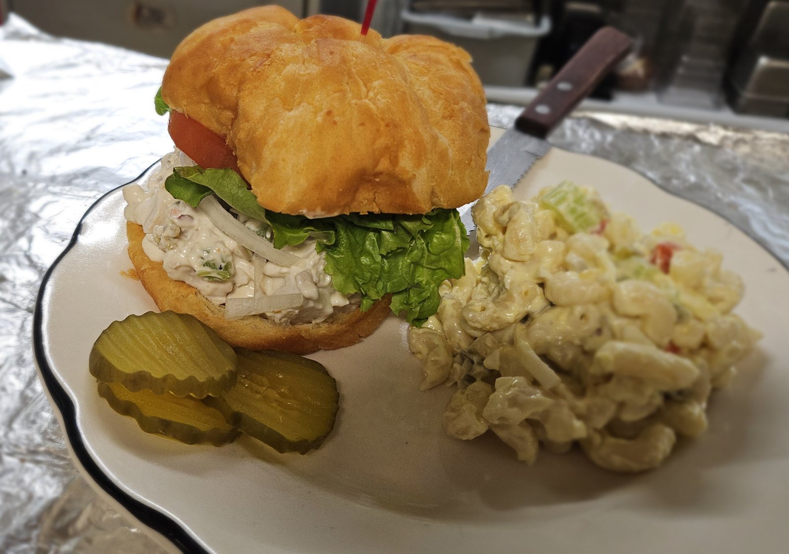 Chicken salad croissant with macaroni salad